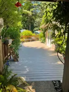 Composite deck shaded by trees at Sherwood home